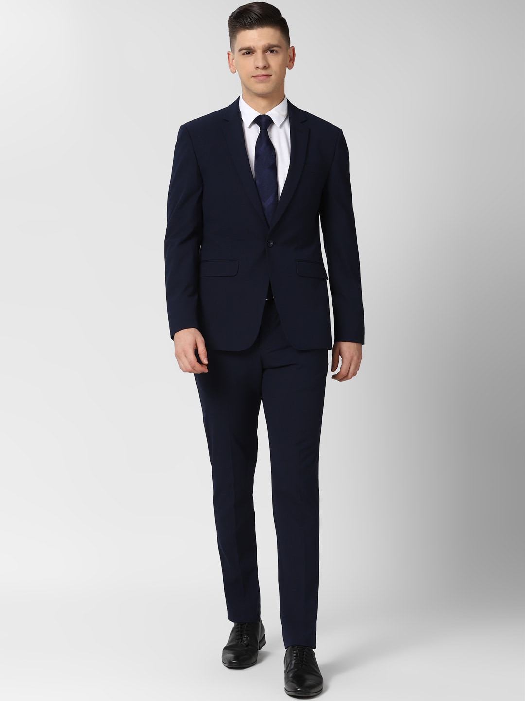 Buy Peter England Elite Men Navy Blue Solid Slim Fit Single Breasted