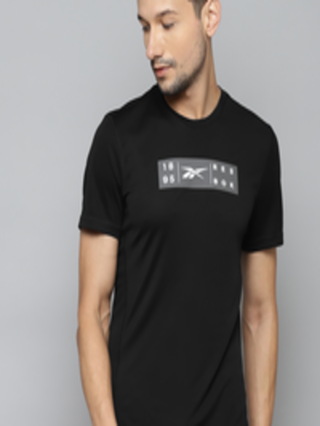 Buy Reebok Men Black & Grey Brand Logo Printed Speedwick T Shirt ...
