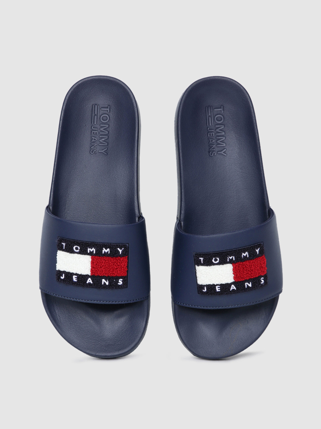 Buy Tommy Hilfiger Men Navy Blue Towelling Flag Sliders - Flip Flops for Men 16285626 | Myntra