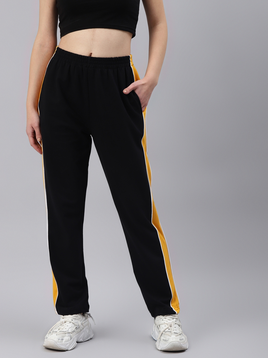 mustard track pants