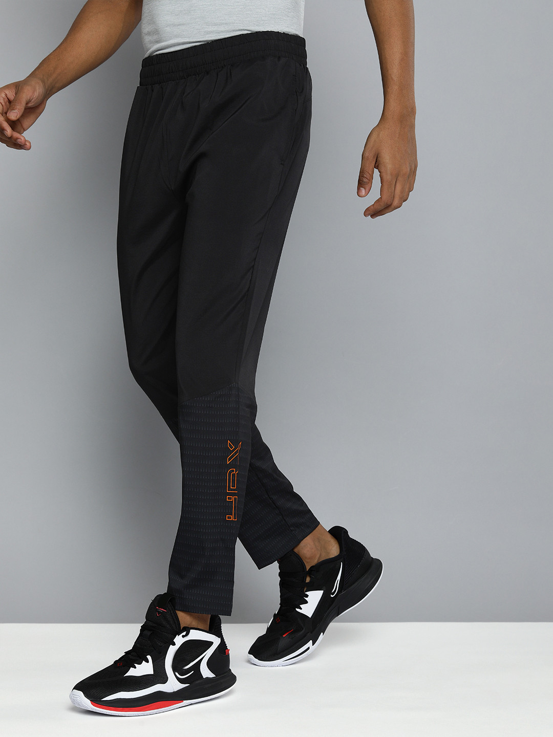 Buy HRX By Hrithik Roshan Men Black Slim Fit Self Design Training Track