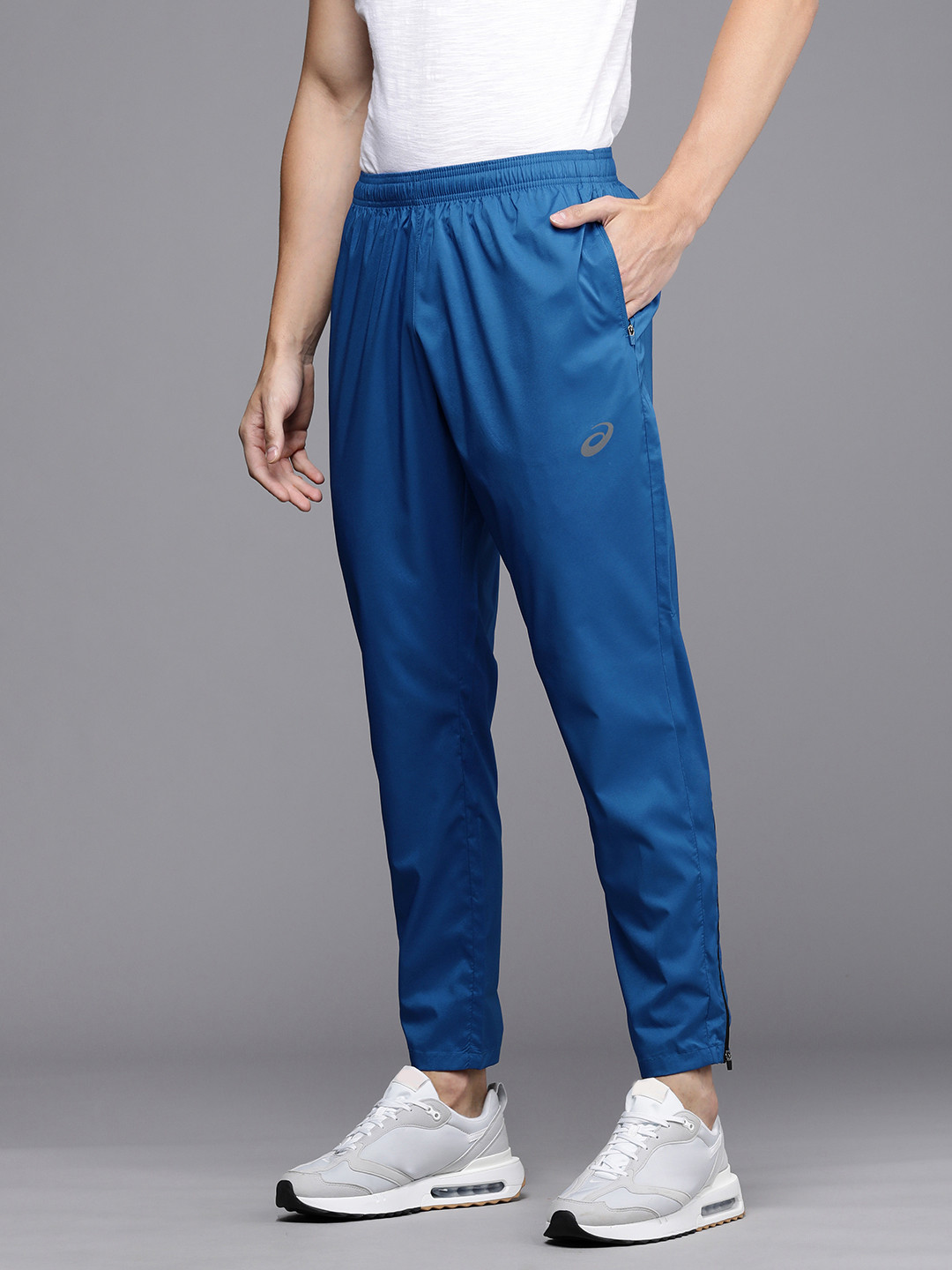 Buy ASICS Men Blue Solid Mid Rise Zip Bottom Woven Running Track Pants