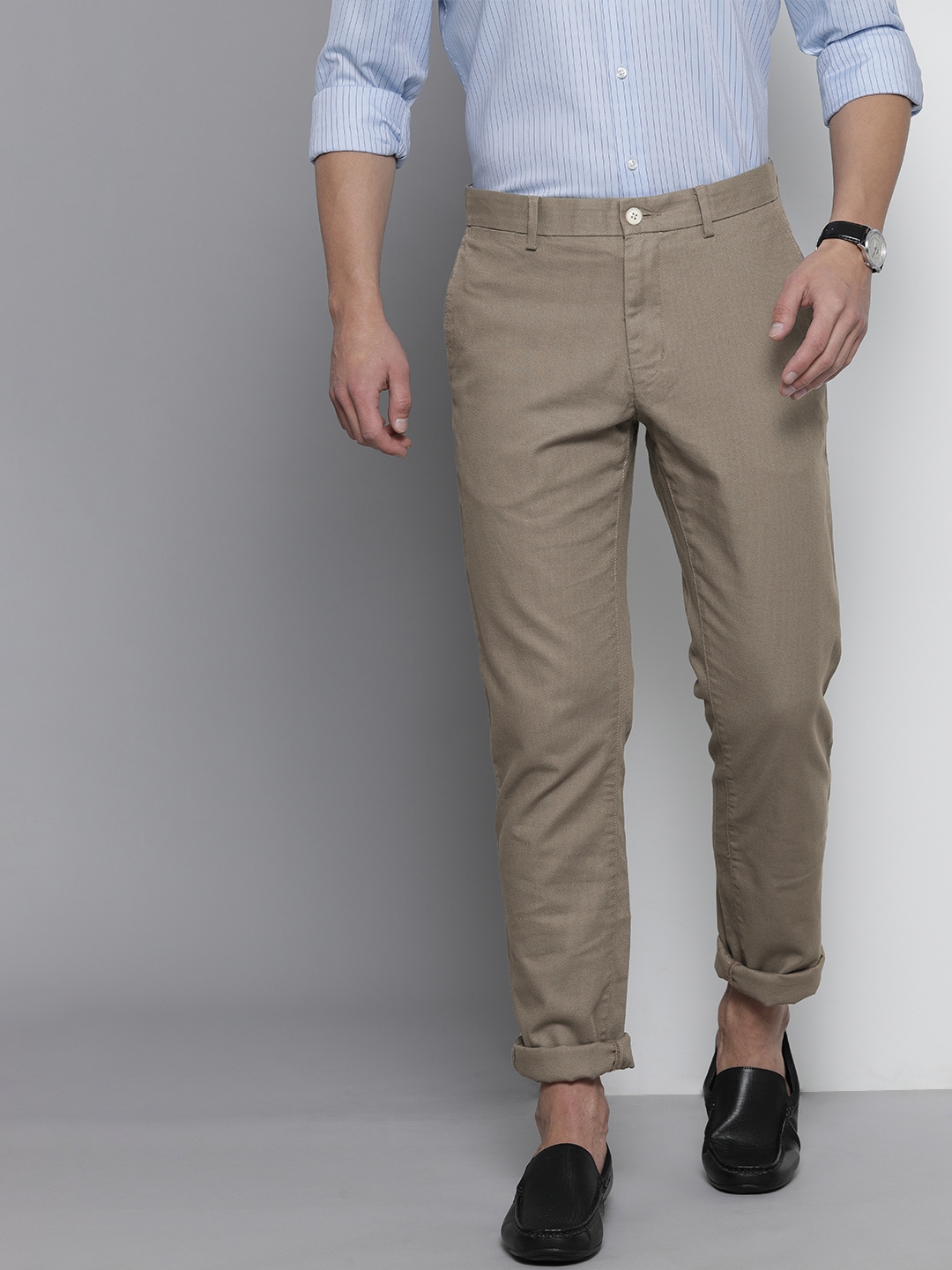 Buy Tommy Hilfiger Men Khaki Solid Regular Trousers - Trousers for Men ...