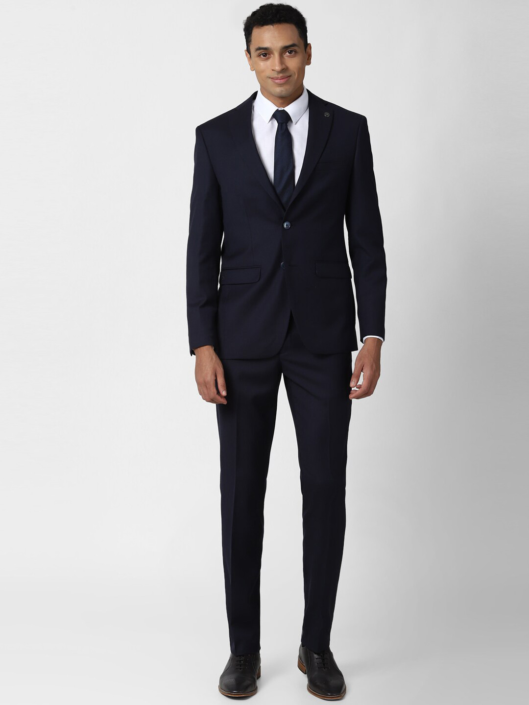 Buy Peter England Elite Men Navy Blue Solid Pure Wool Single Breasted ...