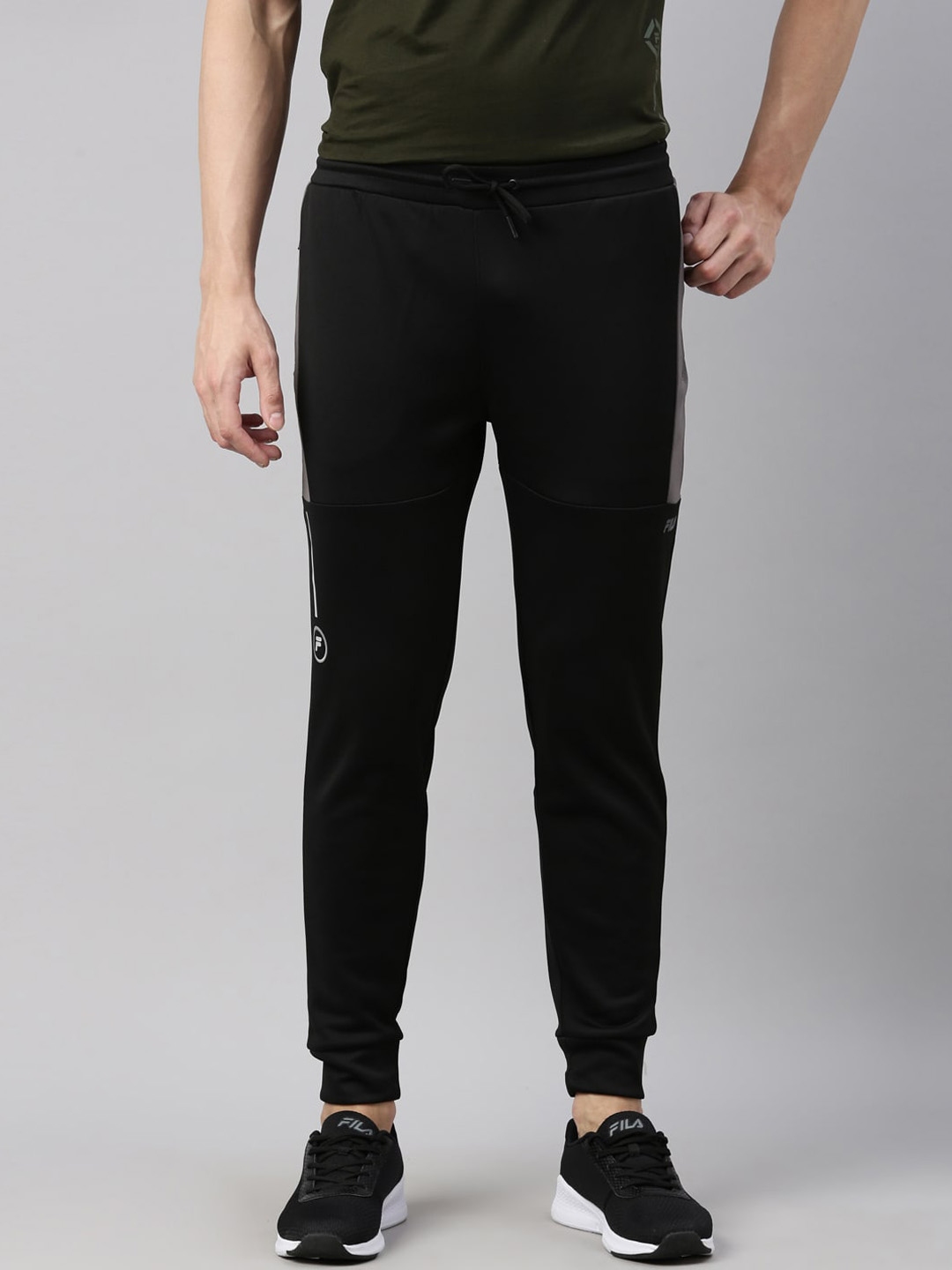 Buy FILA Men Black Solid Joggers - Track Pants for Men 18266966 | Myntra