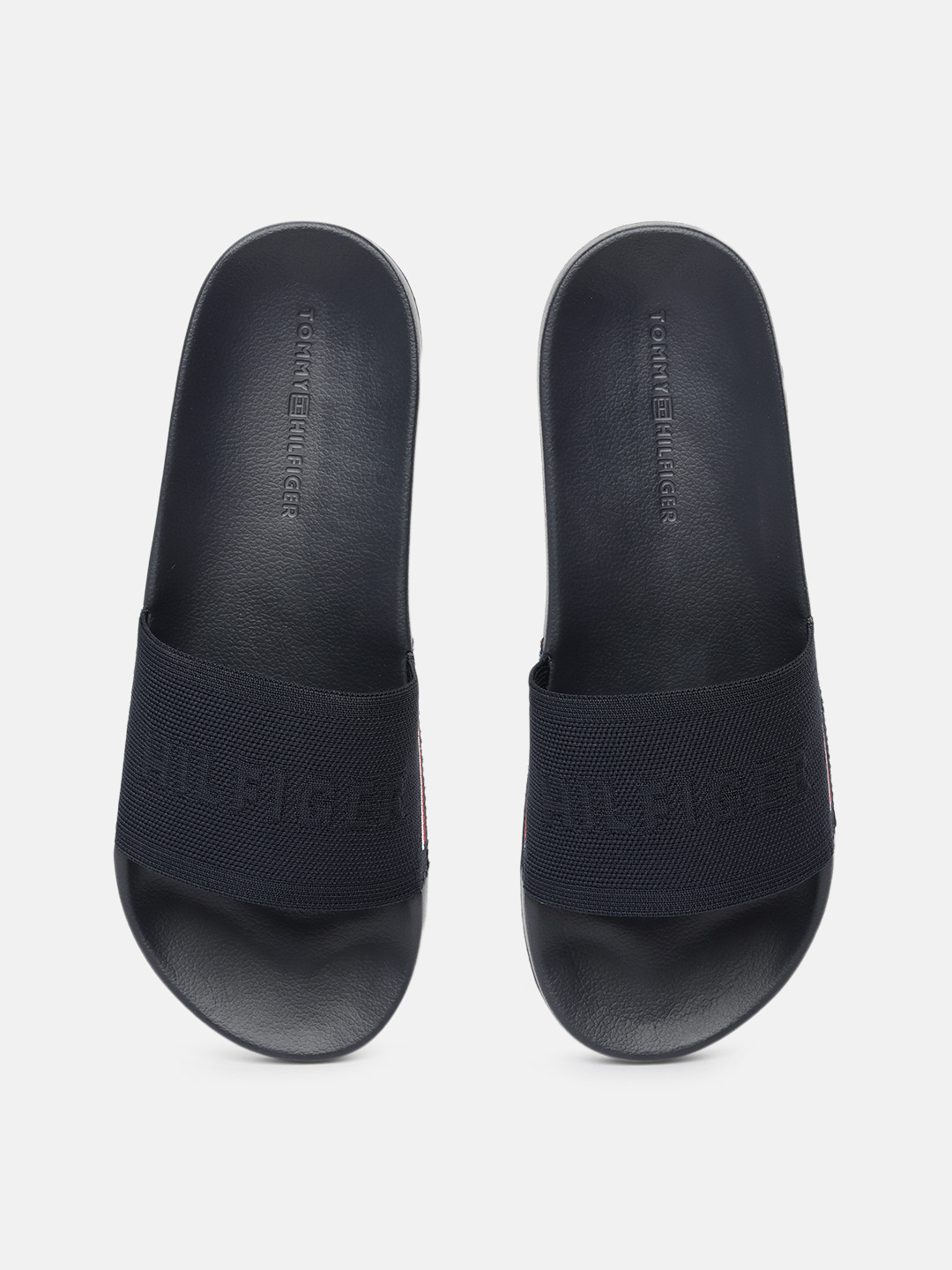 Buy Tommy Hilfiger Men Navy Blue Self Design Sliders - Flip Flops for ...