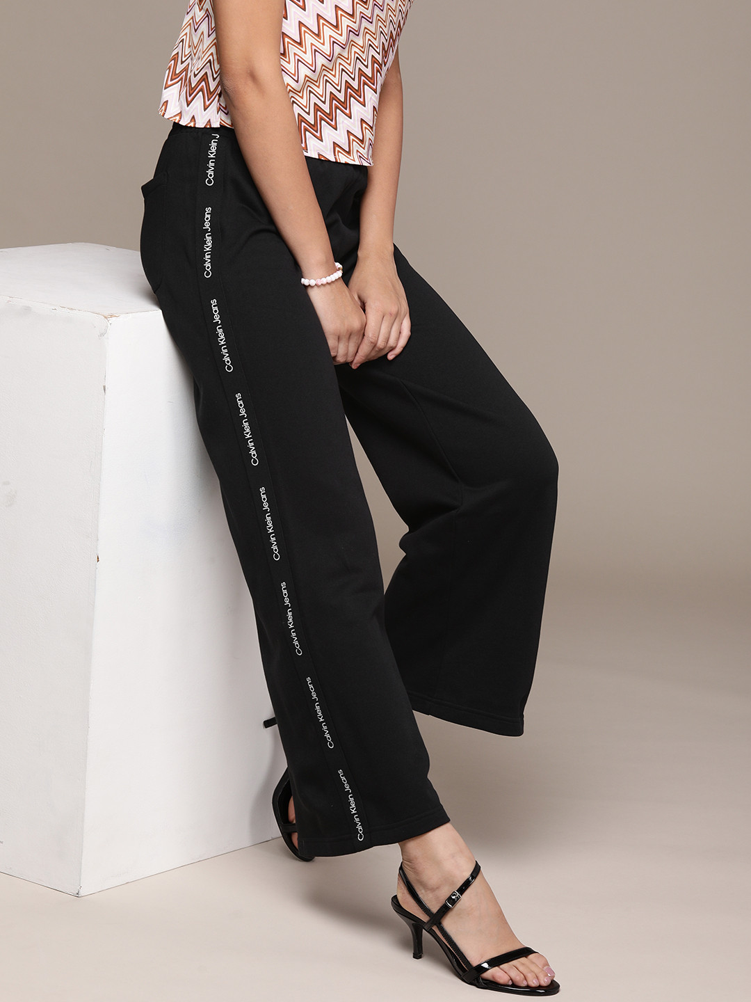 Buy Calvin Klein Jeans Women Black Solid Mid Rise Wide Leg Track Pants