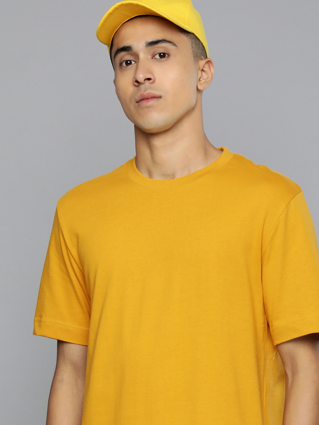 Buy Flying Machine Men Mustard Yellow Solid Pure Cotton T Shirt ...