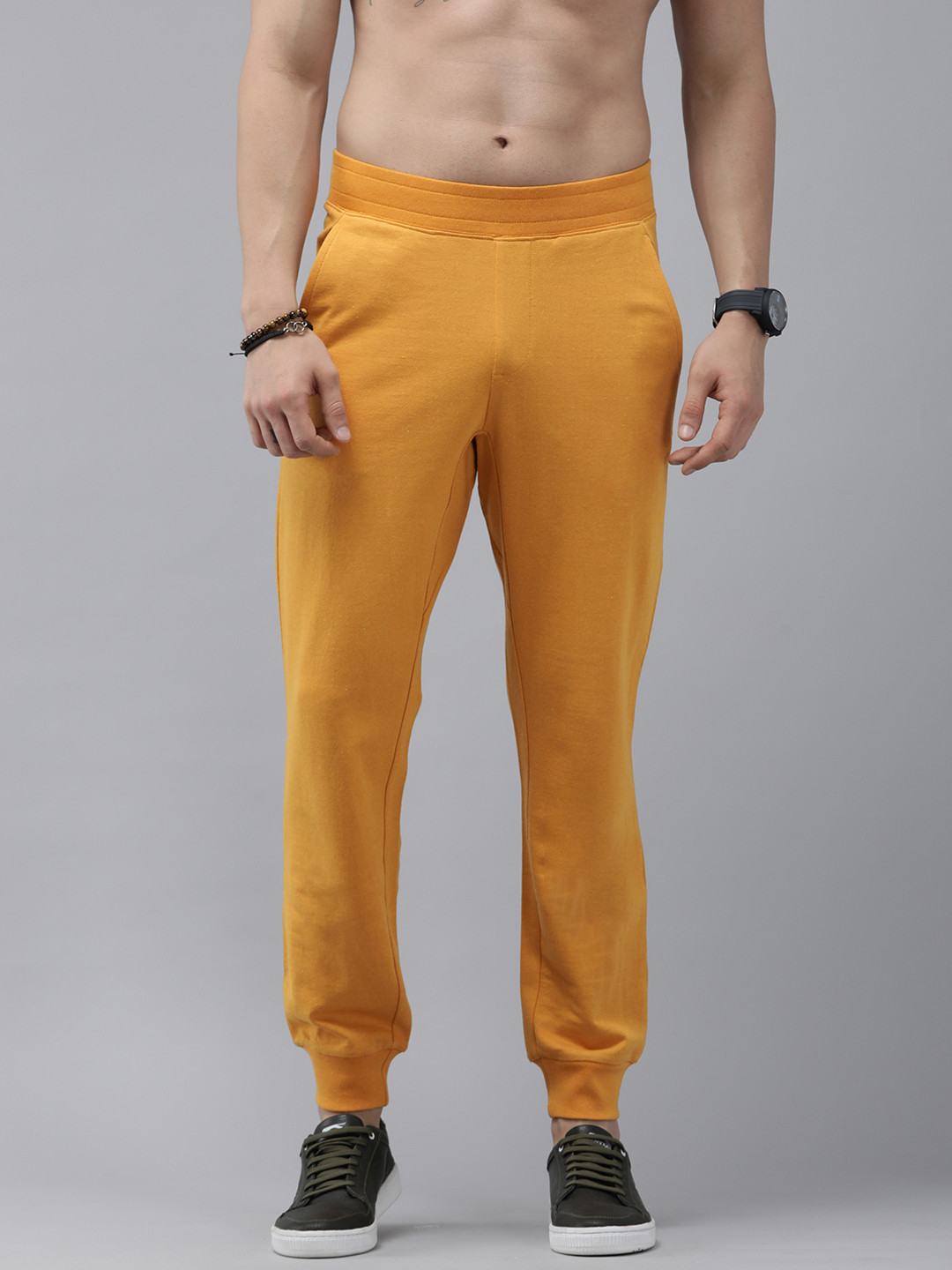 Buy The Roadster Lifestyle Co. Men Mustard Yellow Solid Joggers Track