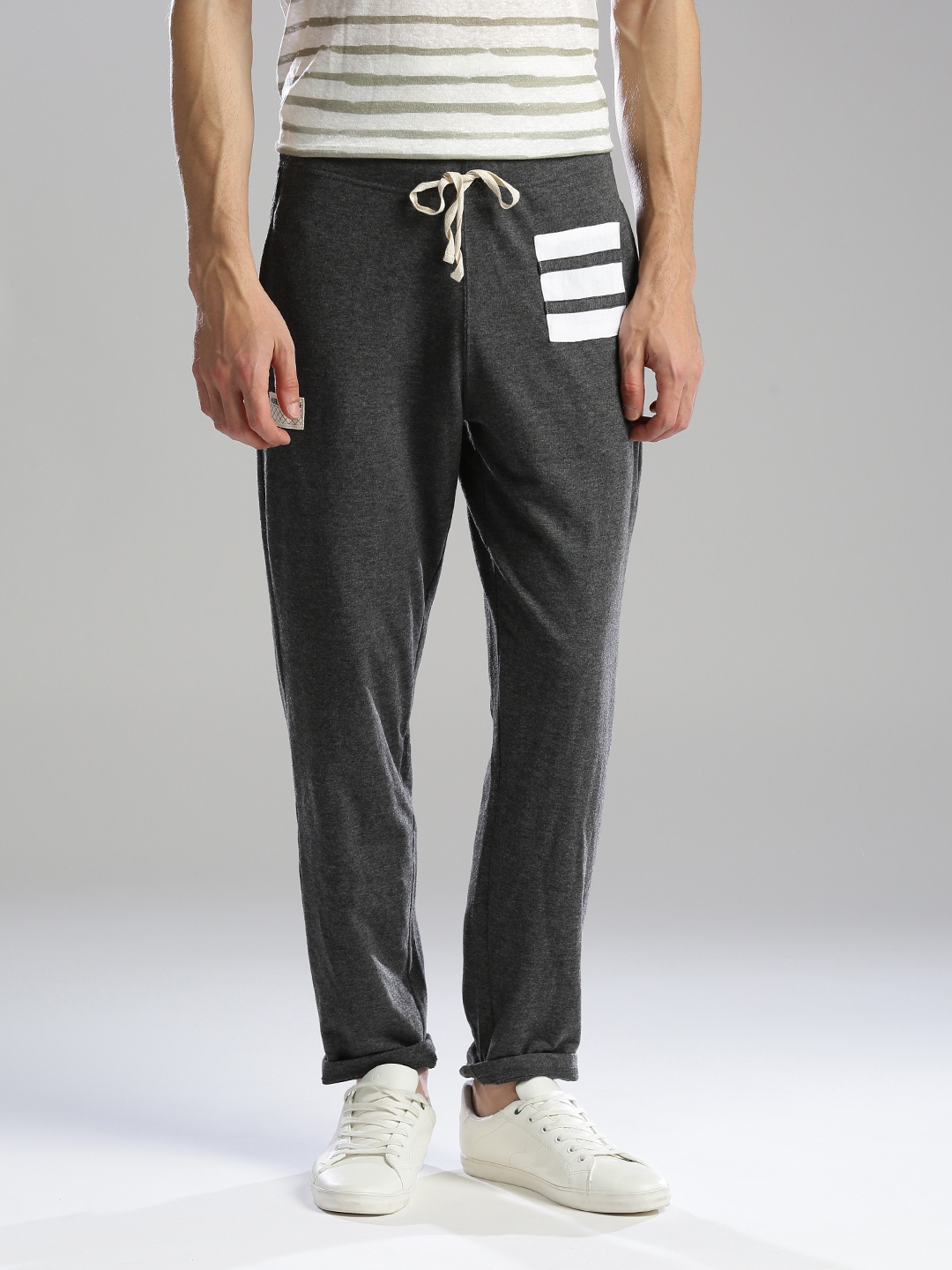 guys in grey track pants