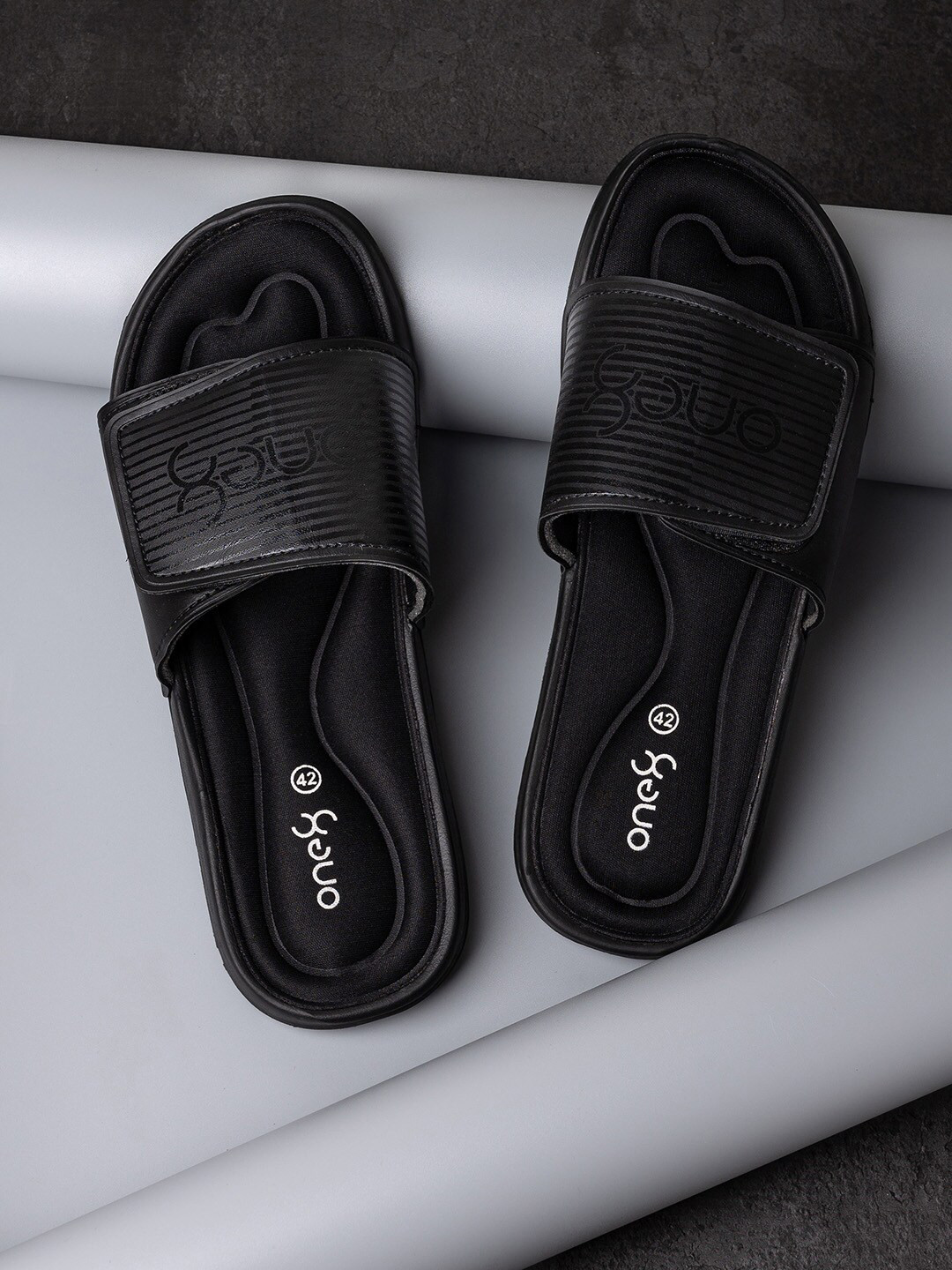 one8 flip flops black