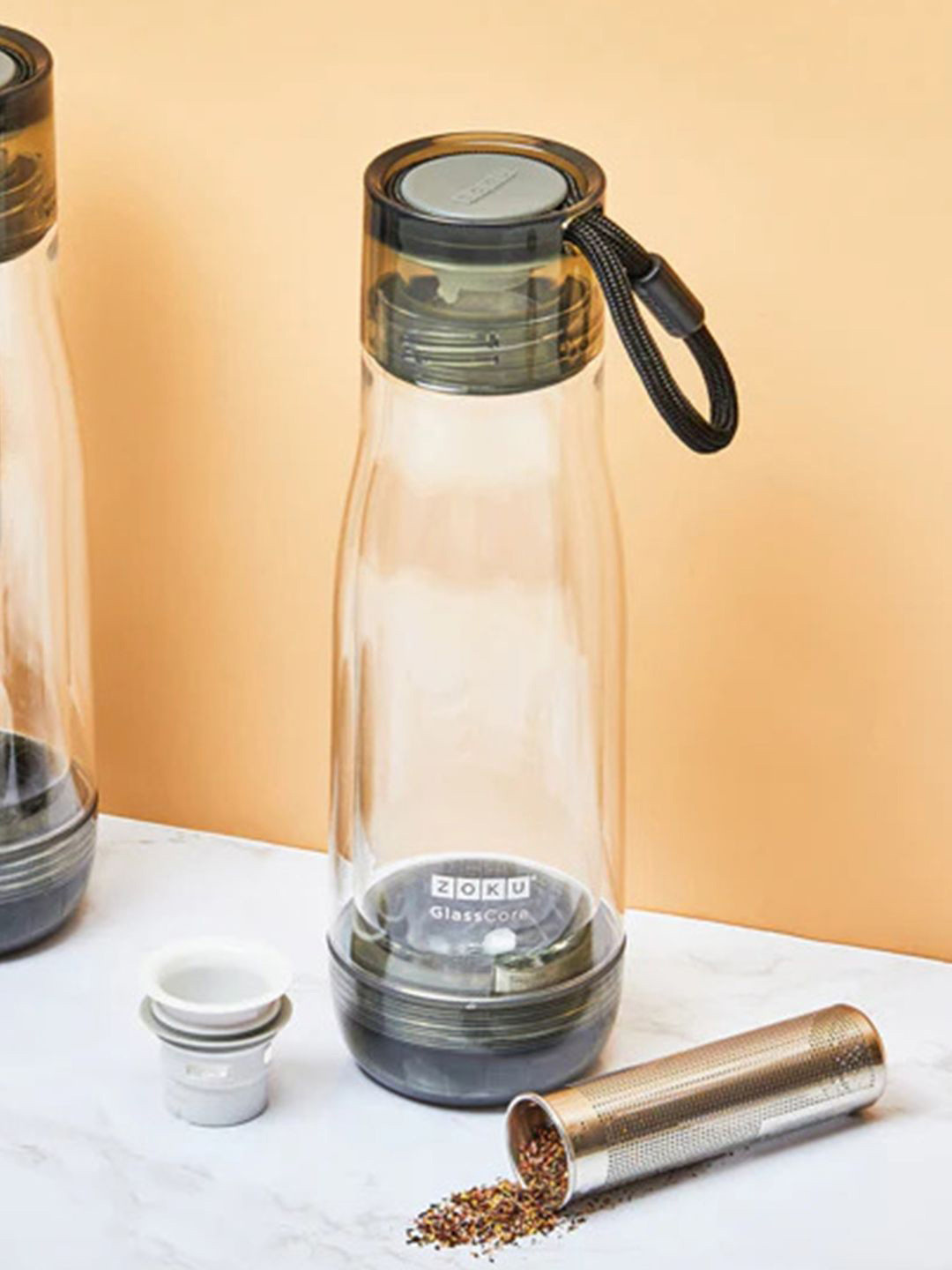 Buy ZOKU Transparent Brand Logo Printed Glass Core Bottle With Tea