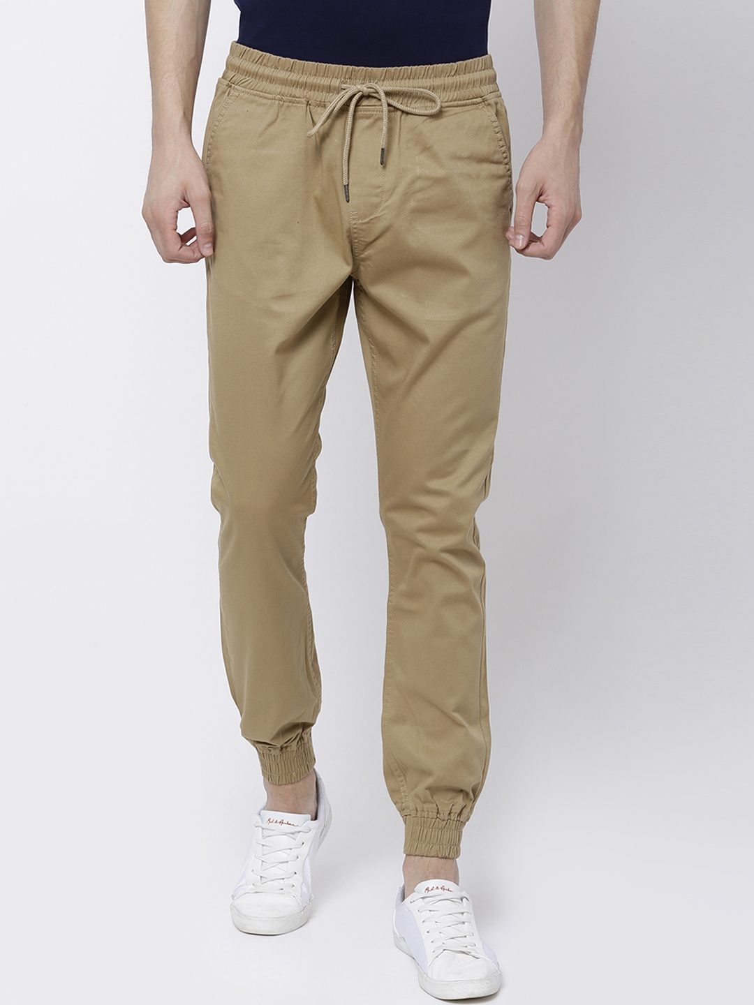 Buy LOCOMOTIVE Men Khaki Slim Fit Solid Joggers - Trousers for Men ...