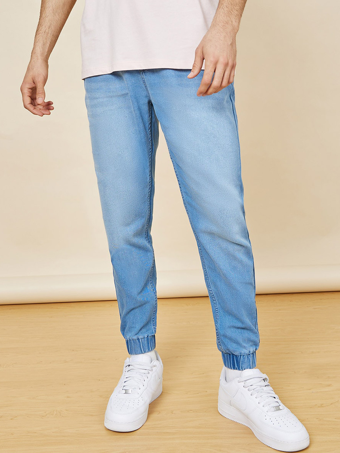 Buy Styli Men High Rise Light Fade Denim Joggers Trousers for Men