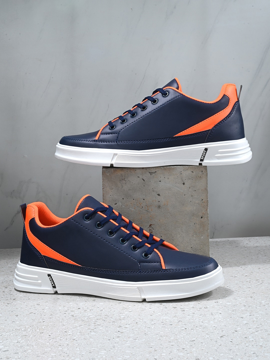 navy blue and orange nike shoes