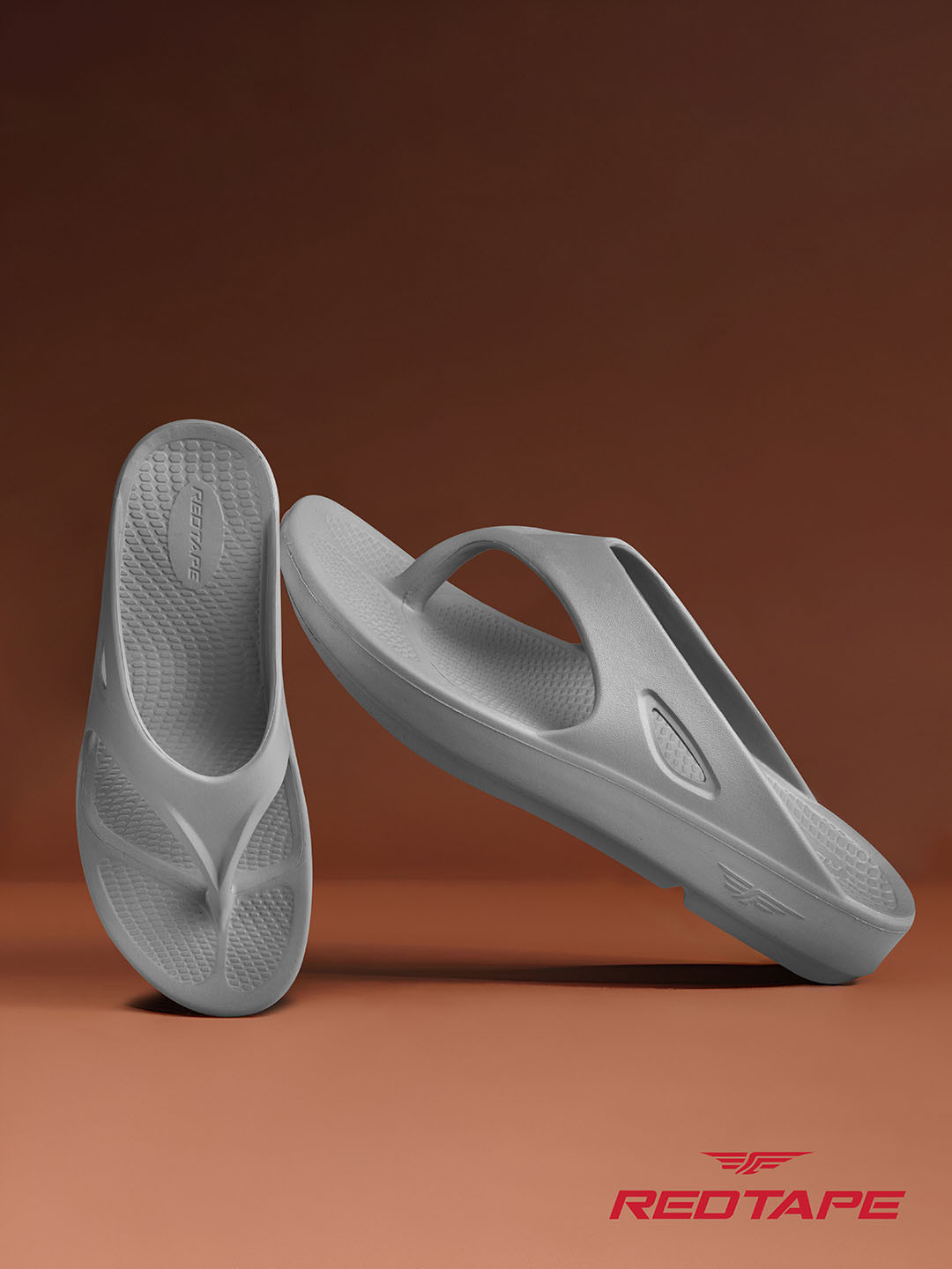 men red tape flip flops