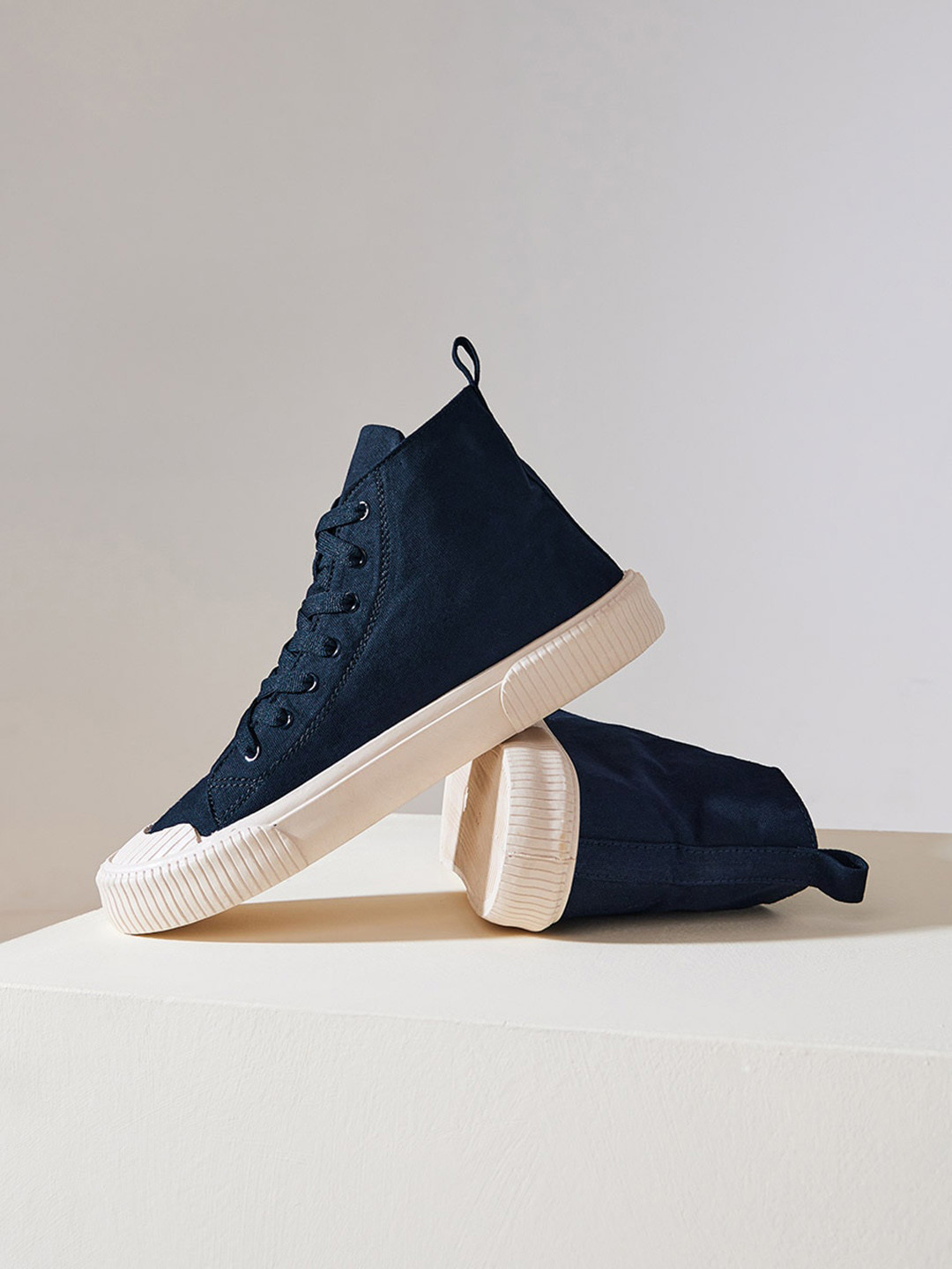 navy and cream shoes
