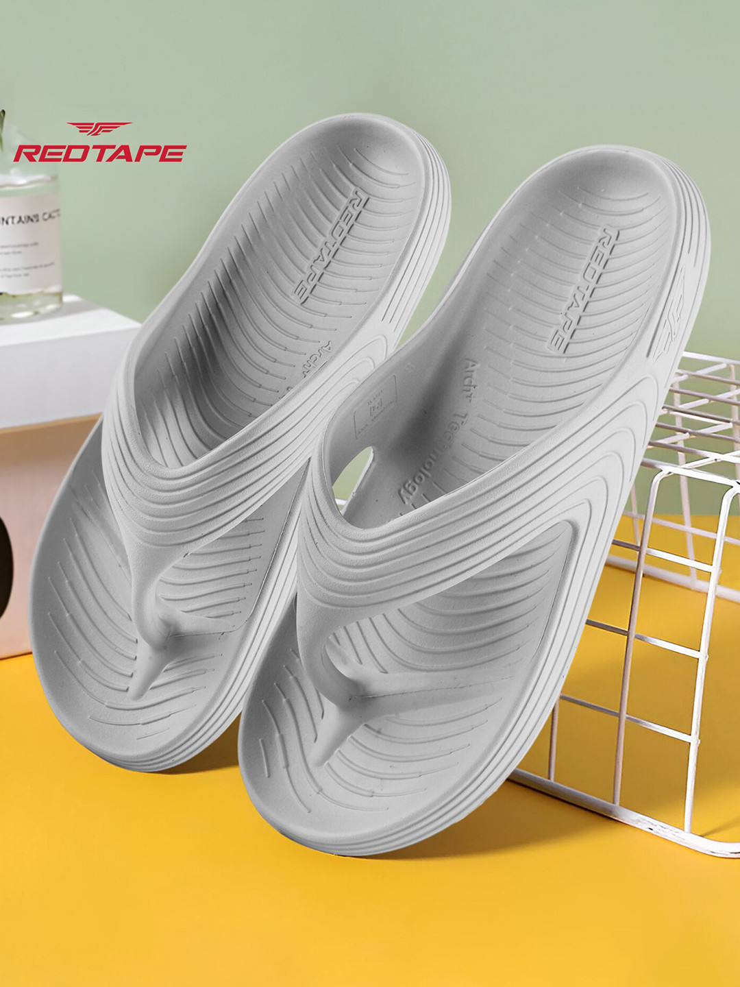 men red tape flip flops