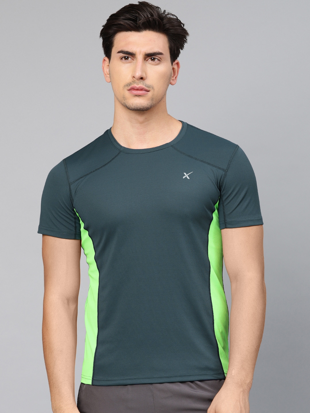 Buy HRX By Hrithik Roshan Men Green Solid Performance Training T Shirt ...