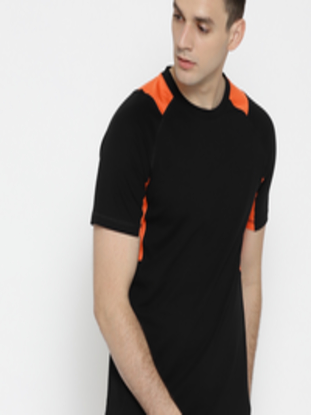 Buy Reebok Men Black Solid Round Neck Pure Cotton T Shirt - Tshirts for ...