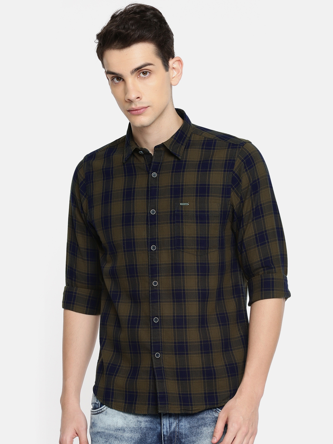 olive green shirt with blue jeans