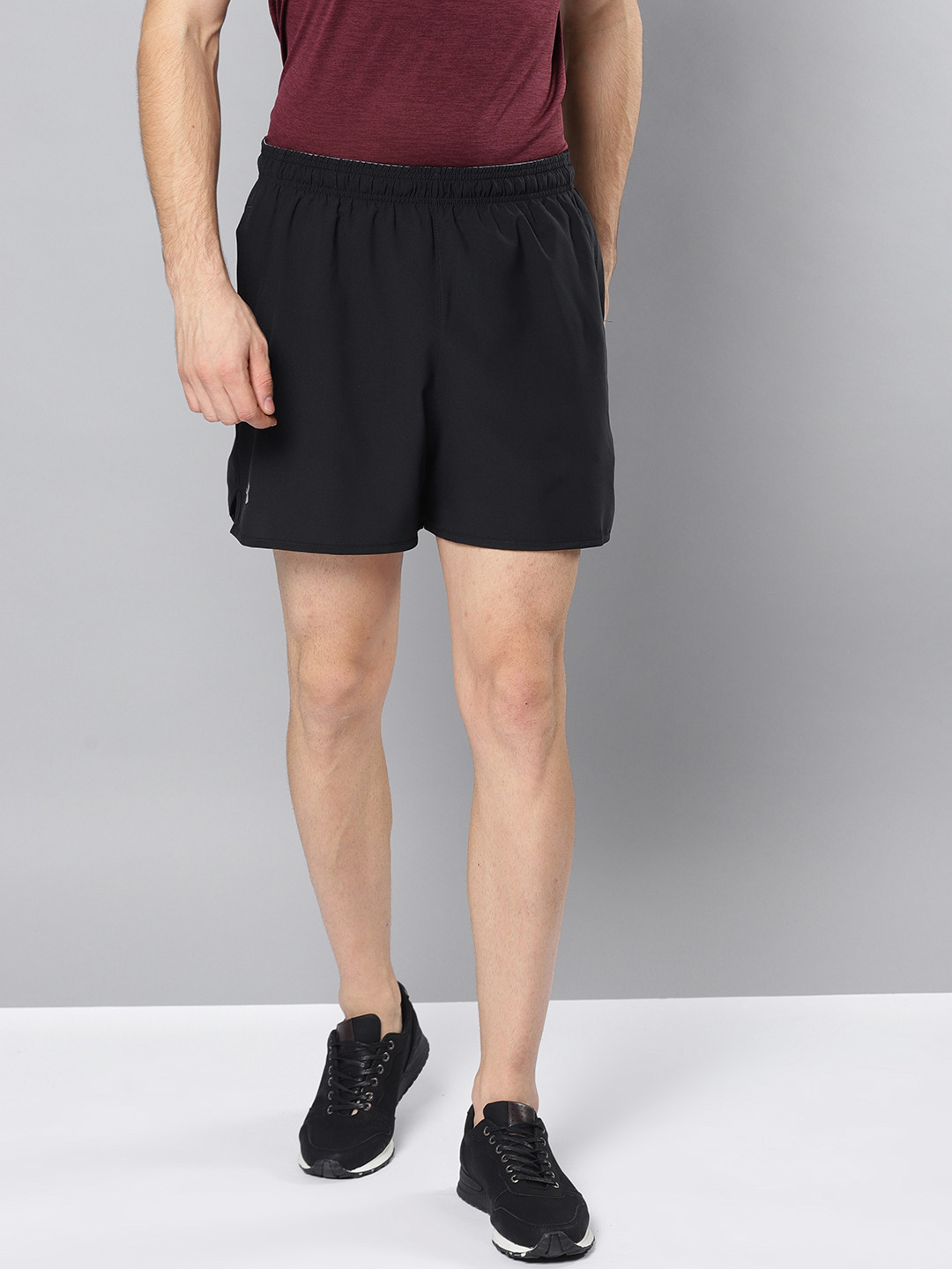 Buy UNDER ARMOUR Men Black Solid Qualifier 5" Woven Sports Shorts