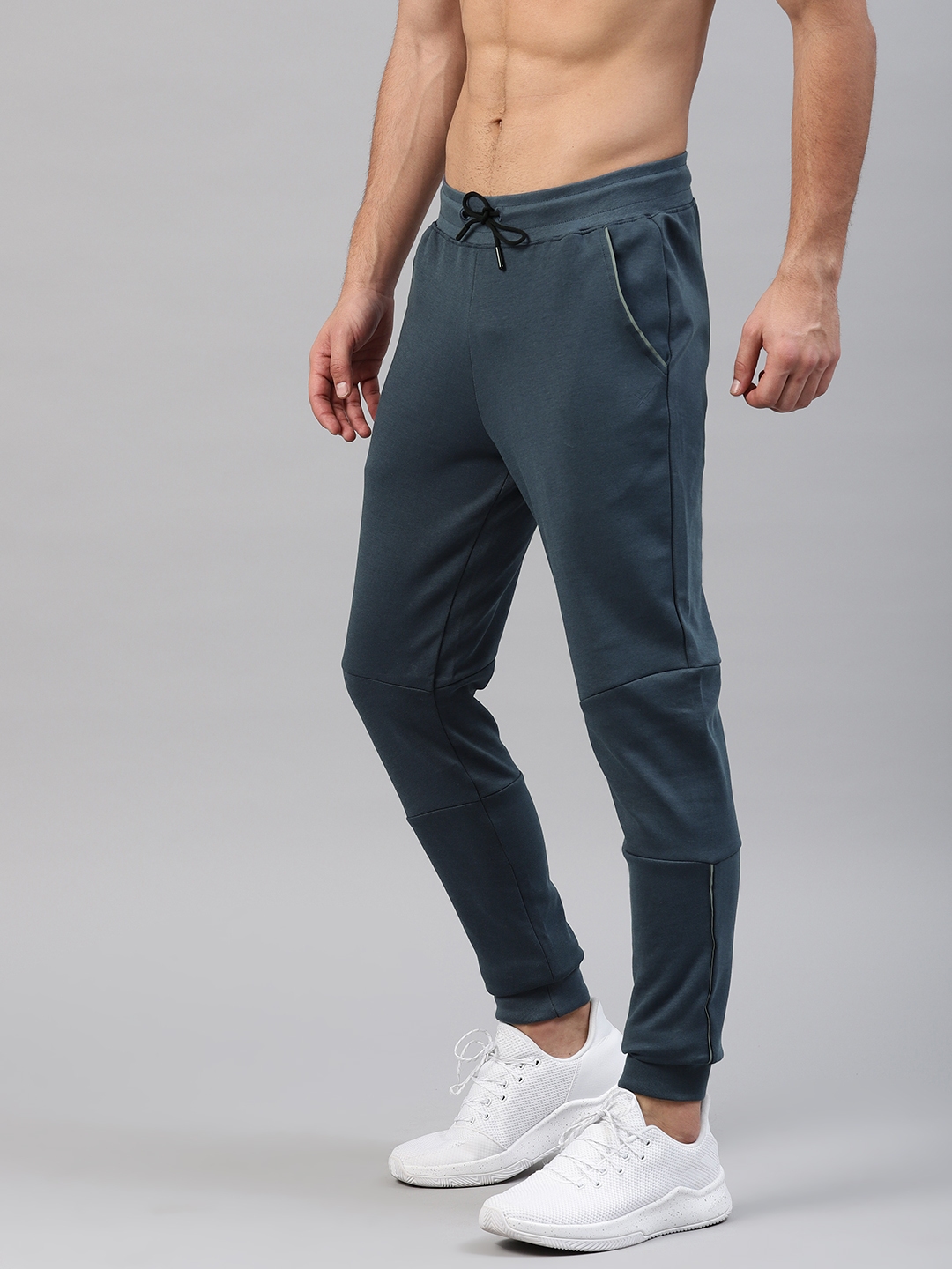 Buy HRX Active By Hrithik Roshan Men Blue Solid Joggers - Track Pants ...