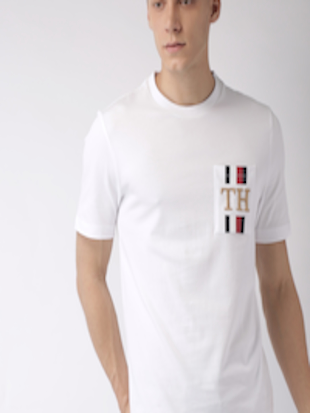 Buy Tommy Hilfiger Men White Solid Round Neck Pure Cotton T Shirt ...