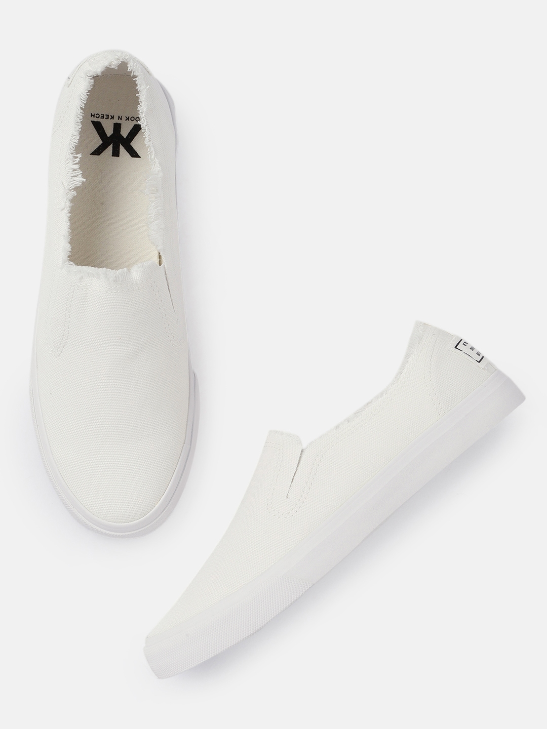ucb white sneakers myntra