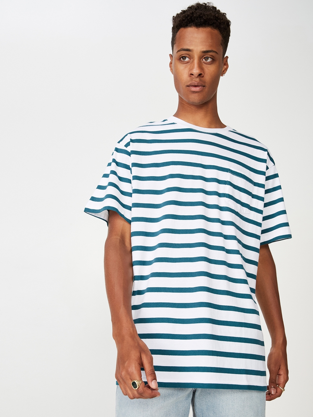 blue and white striped shirt with black pants