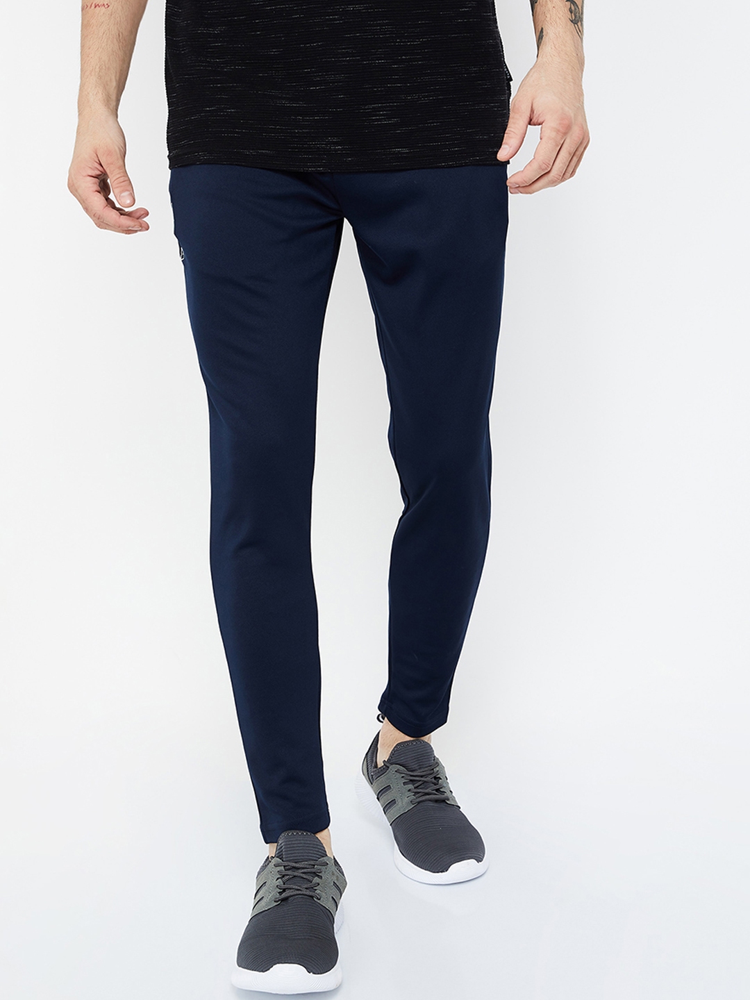 blue track pants with white stripes