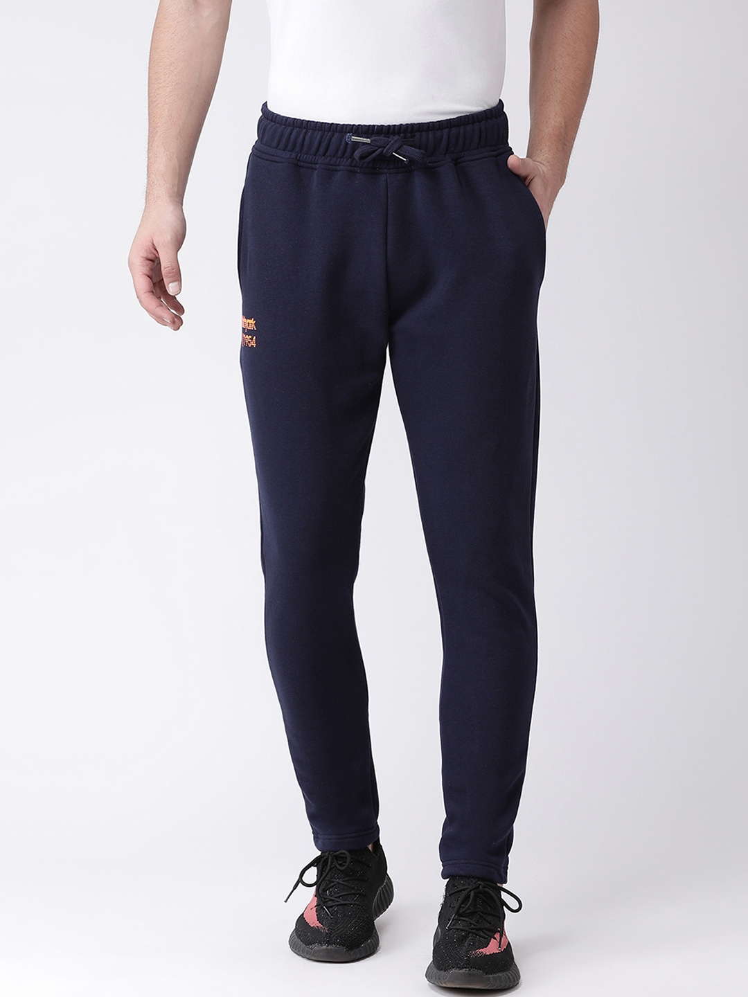 navy blue and white track pants