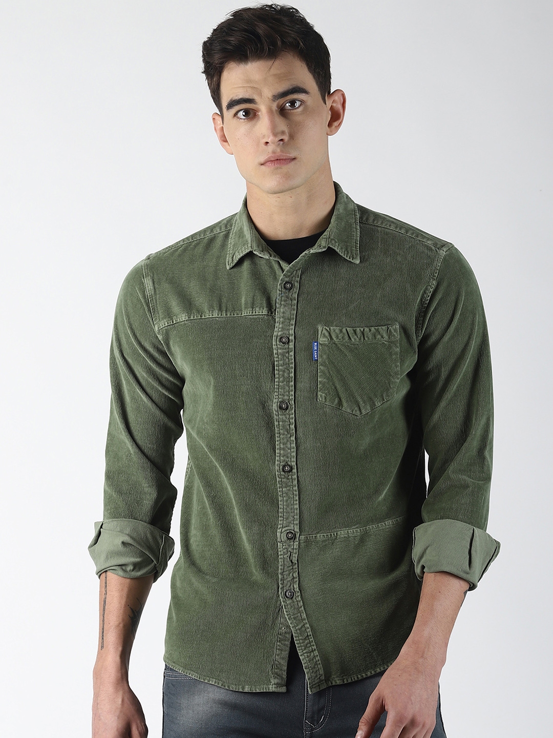 olive green shirt with blue jeans