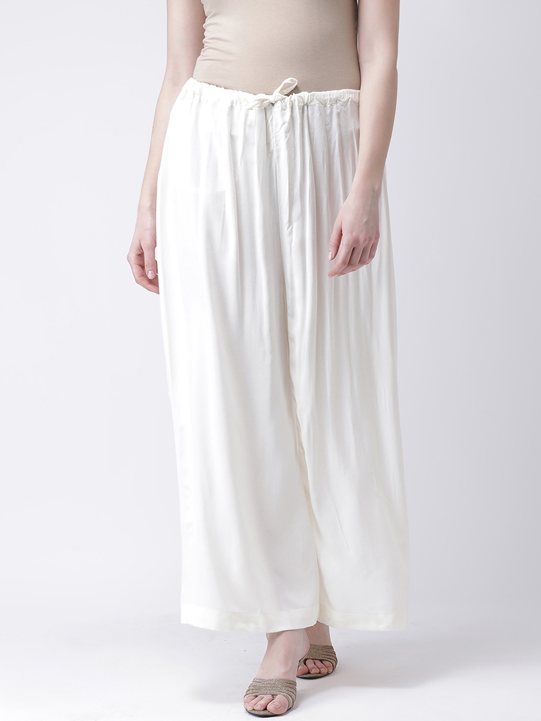 Buy Castle Women Off White Solid Flared Palazzos - Palazzos for Women ...