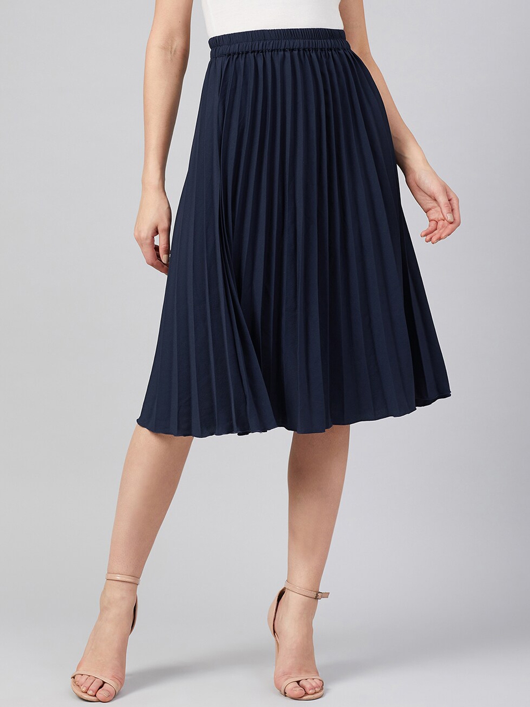 black top with navy blue skirt