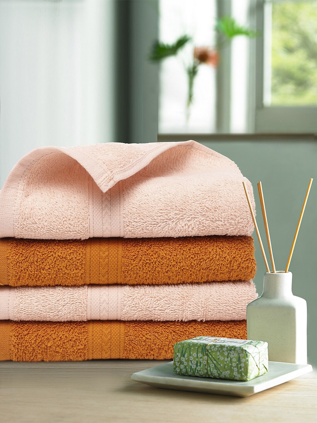 Buy Trident Pack Of 4 Orange & Peach Colored Solid 400 GSM Noon Hand