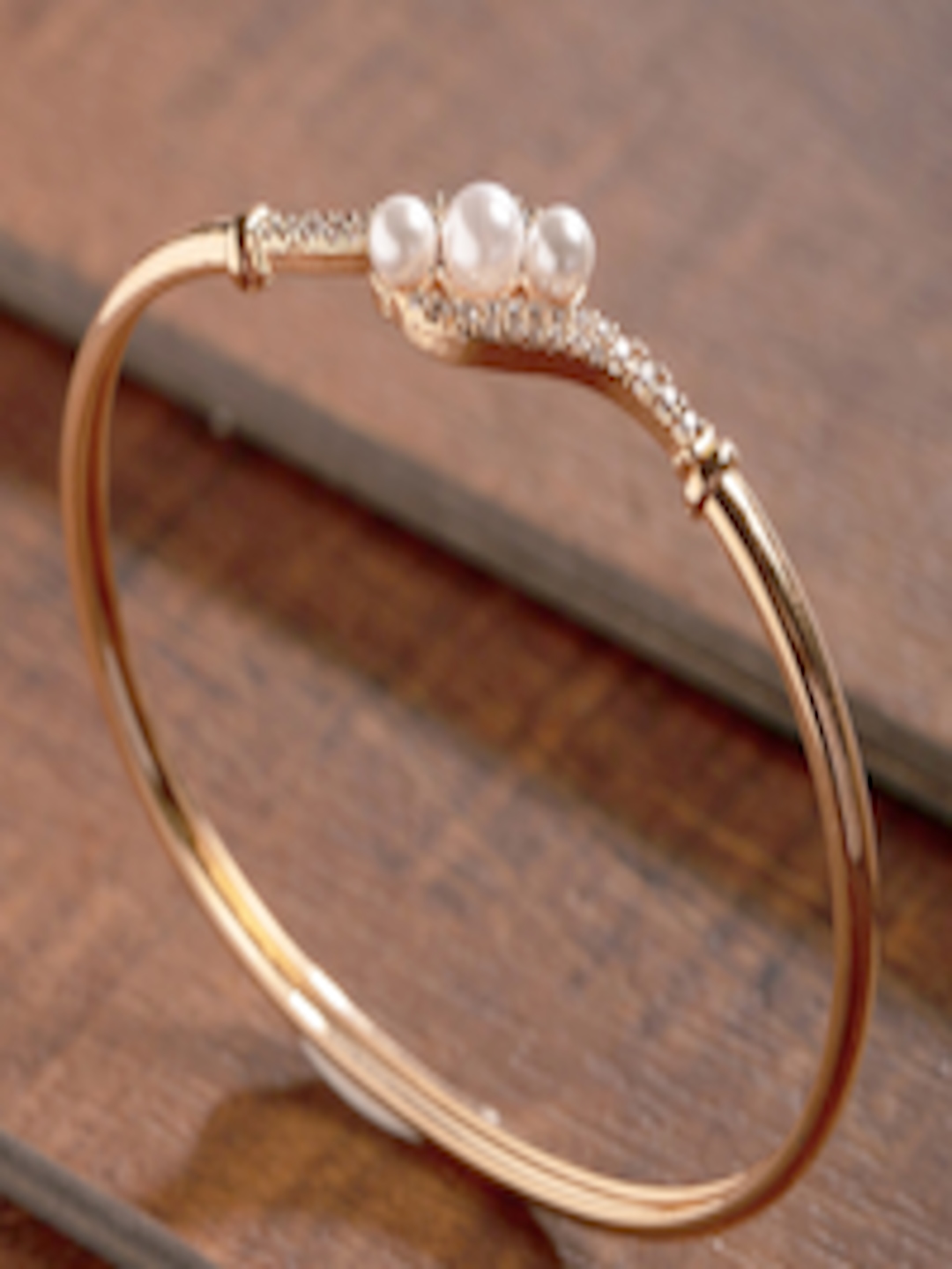 Buy Zaveri Pearls Rose Gold Plated Cubic Zirconia & Pearl Bracelet