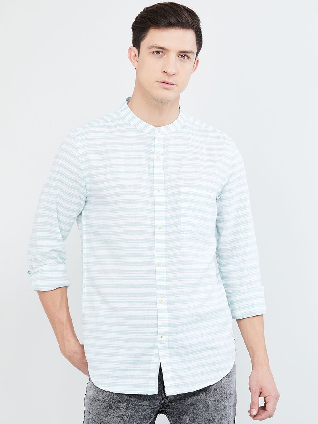 green strike off white shirt