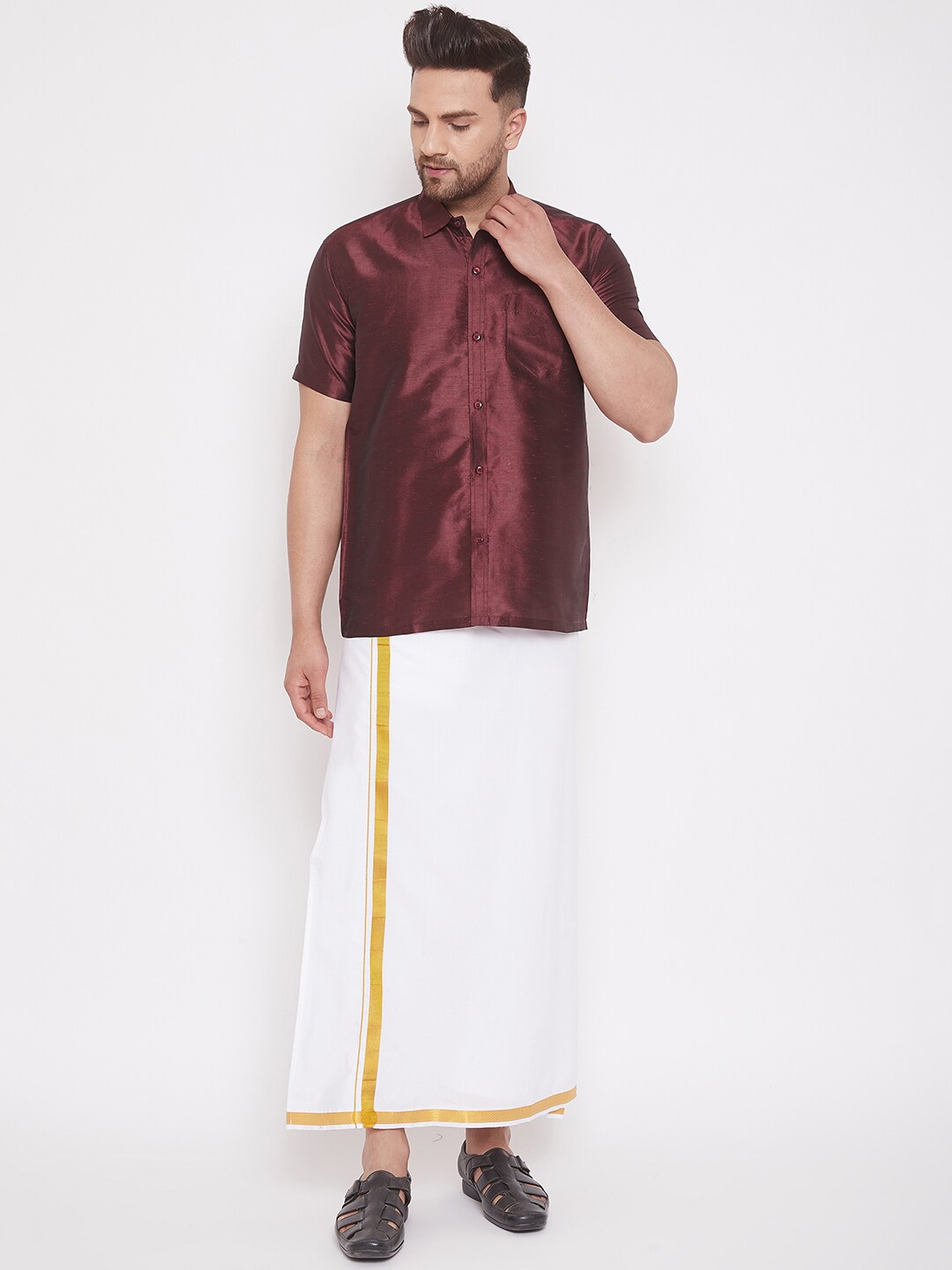 blue shirt and white mundu