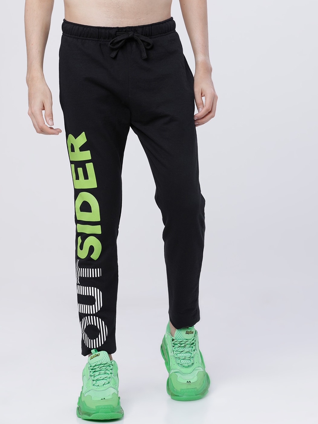 yellow track pants with black stripe