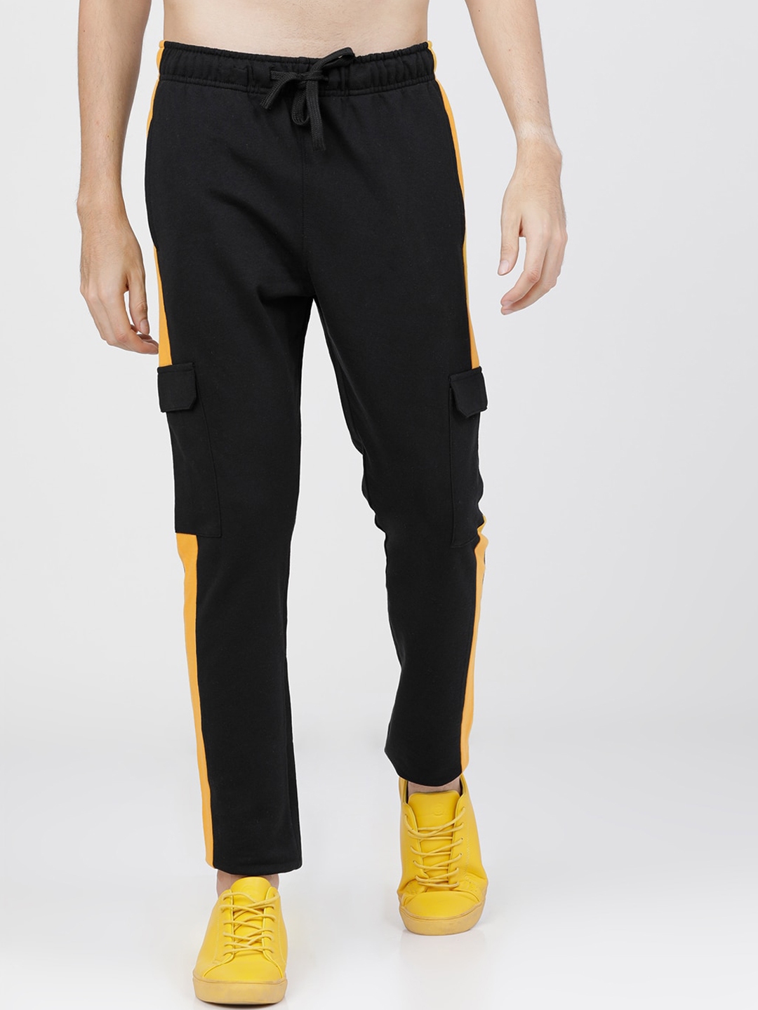 yellow track pants with black stripe