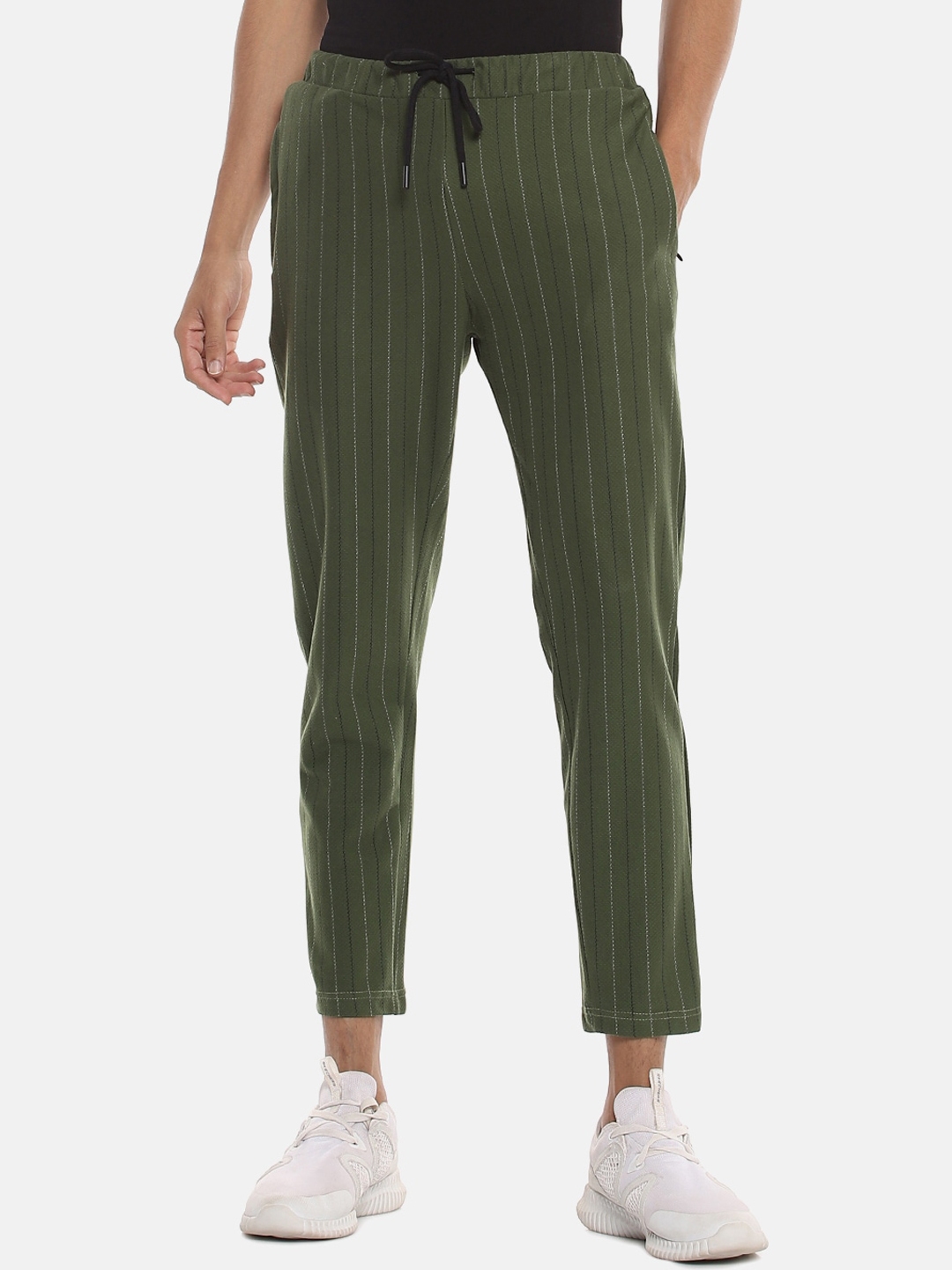 green track pants with white stripe