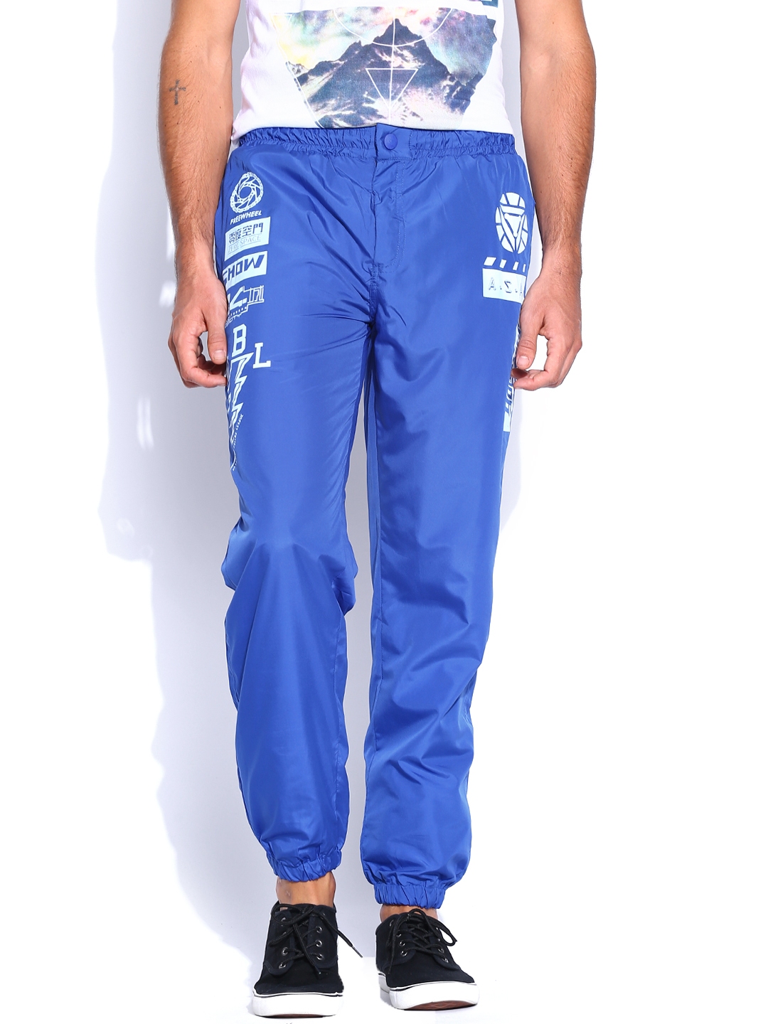 blue track pants with white stripes