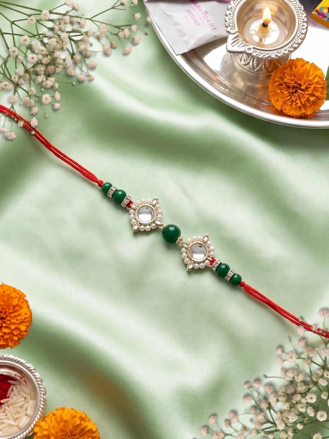 Buy KARATCART Fashionable Gold Plated Green Beads Kundan Rakhi With Roli & Chawal - - Accessories for Men