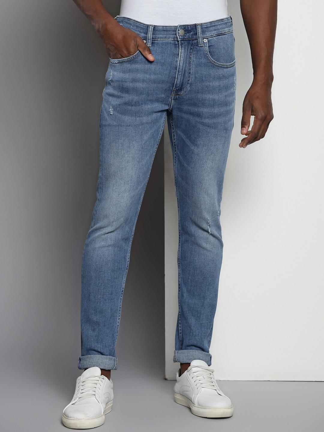 Calvin Klein Jeans Men Tapered Fit Mid Rise Clean Look Light Fade Jeans