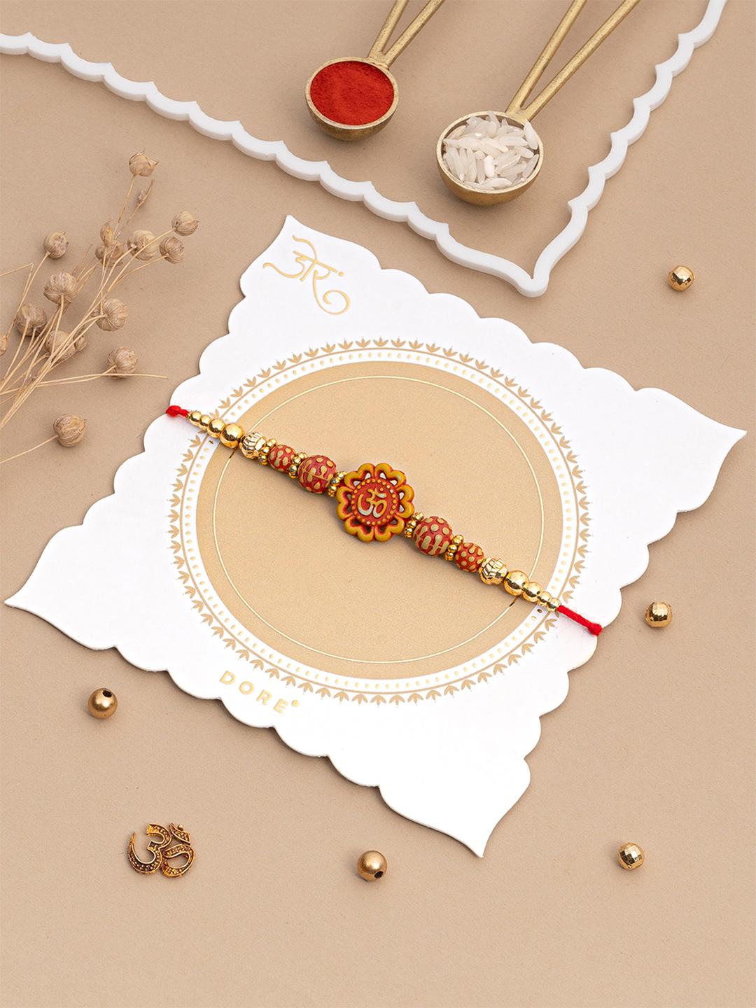 Buy Dore Divine Om Floral Rakhi Set With Sandalwood Beads And Roli Chawal - - Accessories for Unisex