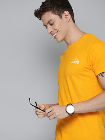 47% OFF on HERENOW Men Mustard Yellow Solid Round Neck Pure Cotton T-shirt with Printed Detailing 47% OFF on HERENOW Men Mustard Yellow Solid Round Neck Pure Cotton T-shirt with Printed Detailing