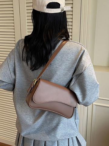 StyleCast x Revolte Structured Sling Bag