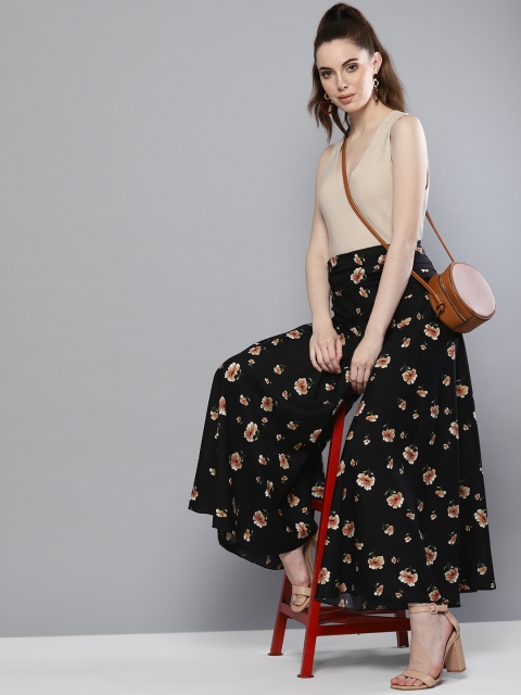 

Trend Arrest Women Black & Beige Printed Flared Palazzos