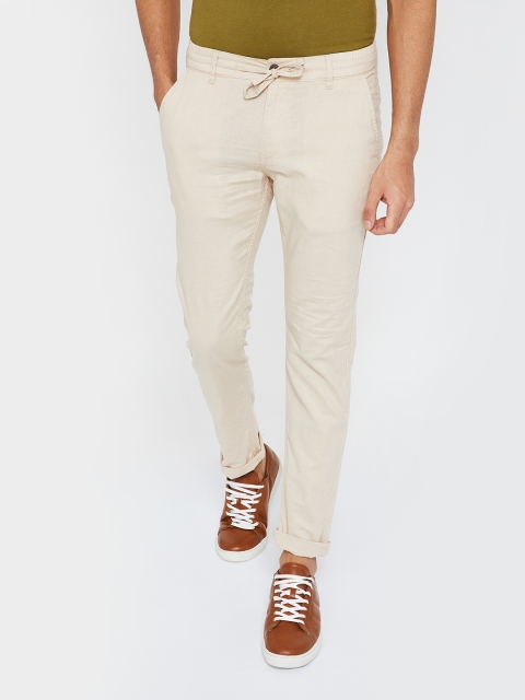 

UCLA Men Beige Slim Fit Solid Regular Trousers